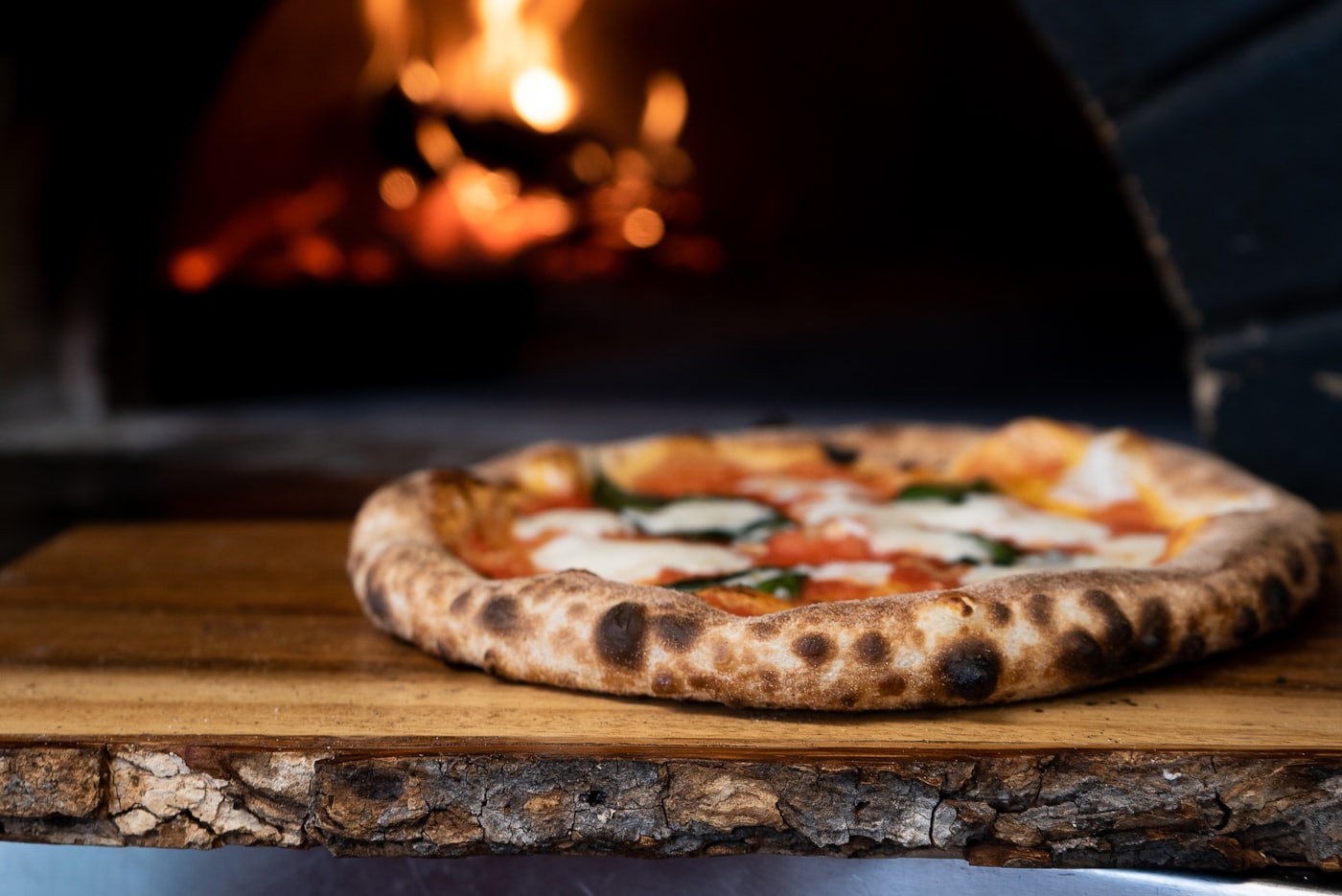 A wood-fired pizza fresh from the oven at Renzetti