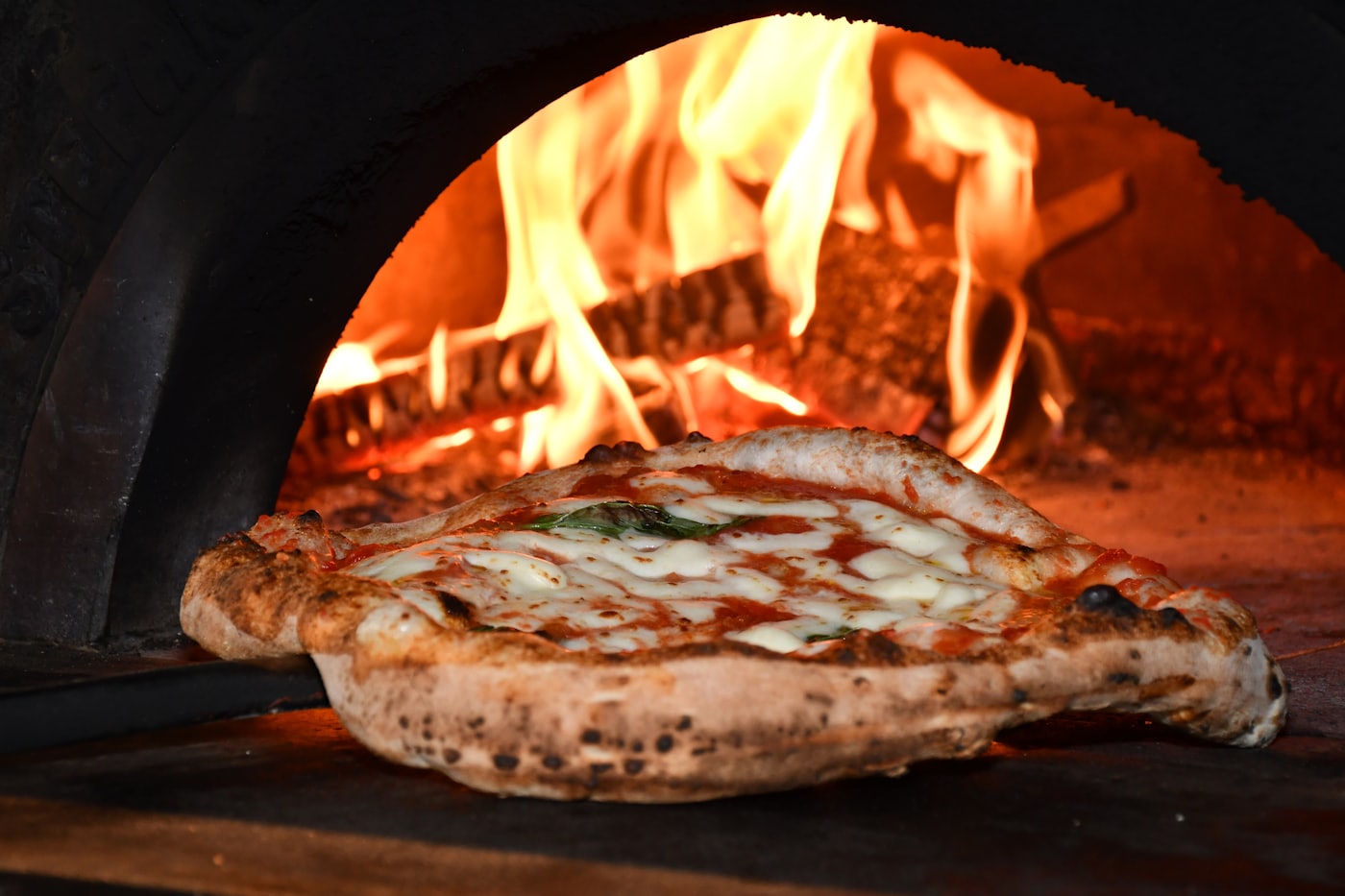 Flames inside the wood-fired oven